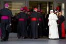 Pope Francis, right, arrives with bishops and cardinals to attend an afternoon session of a two-week synod on family issues at the Vatican, Saturday, Oct. 18, 2014. Catholic bishops predicted widespread approval Saturday of a revised document laying out the church's position on gays, sex, marriage and divorce, saying the report is a "balanced" reflection of church teaching and pastoral demands. The final report of the two-week meeting of bishops will be voted on later Saturday. (AP Photo/Andrew Medichini)