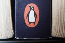 A book on display with the penguin logo. in Cirencester, England. Pearson PLC will merge its Penguin Books division with Random House, which is owned by German media company Bertelsmann, in an all-share deal that will create the world's largest publisher of consumer books, it was reported on Monday, Oct. 29, 2012. The planned joint venture brings together classic and best-selling names. As well as publishing books from authors such as John Grisham, Random House scored a major hit this year with "Fifty Shades of Grey." Penguin has a strong backlist, including George Orwell, Jack Kerouac and John Le Carre. (AP Photo/Tim Ireland/PA) UNITED KINGDOM OUT NO SALES NO ARCHIVE