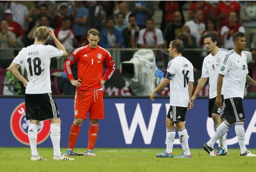 Germany's Neuer and his team mates react after losing their Euro 2012 semi-final soccer match against Italy at the National Stadium in Warsaw