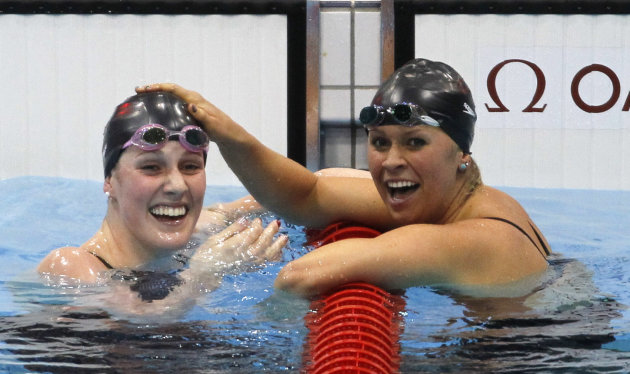 Missy Franklin of the U.S. celebrates with team mate Elizabeth Beisel after they took gold and bronze in the women's 200m backstroke final in London