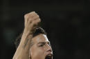 FILE - In this Nov. 14, 2014, file photo, Colombia's captain James Rodriguez celebrates after his teammate Carlos Bacca, scored against USA, during an international friendly soccer match at the Craven Cottage ground in London. The U.S. has imposed sanctions on Rodriguez's first professional team, the Envigado soccer club, for alleged ties to a drug cartel. The Treasury Department on Wednesday Nov. 19, 2014, placed the club and its owner, Juan Pablo Upequi, on its foreign narcotics kingpins list, freezing any U.S. assets they may have and barring Americans from doing business with them. (AP Photo/Lefteris Pitarakis, File)