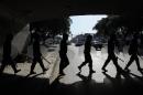 Riot police guard a supermarket attacked by looters in San Fernando, Buenos Aires province, Argentina on December 21, 2012