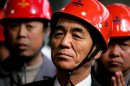 North Korea's Premier Pak Pong-ju wears a hard hat as he visits the Anshan Steel factory in northeastern China