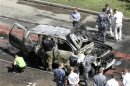 Russian investigators work near the scene of a car bomb blast in the city of Kazan