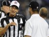 Referee Gene Steratore, left, talks with Baltimore Ravens head coach John Harbaugh before an NFL football game between the Ravens and the Cleveland Browns in Baltimore, Thursday, Sept. 27, 2012. (AP Photo/Nick Wass)