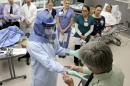New Ebola gear guidelines: head-to-toe coverage