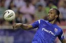 Shanghai Shenhua's striker Didier Drogba controls the ball during the Chinese Super League match against Hangzhou green town at the Shanghai Hongkou Stadium in Shanghai