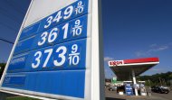 <p>               In this Sept. 27, 2011 photo, cars line up at the pumps at an Exxon mini-mart in Carnegie, Pa. Consumers paid more for food and gas last month, although inflation outside those volatile categories was tame. (AP Photo/Gene J. Puskar)
