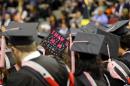 A Berklee College of Music graduate thanks her mom on her mortarboard during the school's commencement in Boston, Saturday, May 10. 2014. (AP Photo/Winslow Townson)