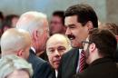 In this photo provided by Miraflores presidential press office, Venezuela's President Nicolas Maduro, right, speaks with U.S. Vice President Joe Biden on the sidelines of the swearing-in ceremony of Brazil's reelected President Dilma Rousseff in Brasilia, Brazil, Jan. 1, 2015. The meeting came two weeks after President Barack Obama signed legislation to impose sanctions on Venezuelan officials accused of violating human rights. Last week, Maduro accused the U.S. of waging a war to destroy the South American country's socialist revolution. (AP Photo/Miguel Angulo, Miraflores Presidential Office)