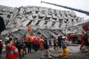 The Latest: More than 100 missing, 13 dead in Taiwan quake