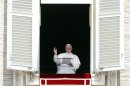 Pope Francis speaks to the faithful as he leads the Angelus prayer from the window of the Apostolic Palace in Saint Peter's Square at the Vatican