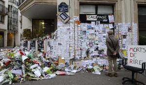 People visit a makeshift memorial near the headquarters&nbsp;&hellip;