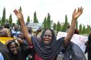 A mother cries out during a demonstration with others who have daughters among the kidnapped