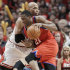 Philadelphia 76ers forward Thaddeus Young (21) drives to the basket against Chicago Bulls forward Taj Gibson during the third quarter of Game 2 in an NBA basketball first-round playoff series, in Chicago on Tuesday, May 1, 2012. (AP Photo/Nam Y. Huh)