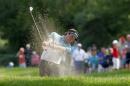 Bubba Watson hits out of a sand trap on the 13th hole during the second round of the Travelers Championship golf tournament, Friday, June 26, 2015, in Cromwell, Conn. (AP Photo/Stew Milne)