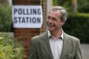 Nigel Farage, leader of Britain's United Kingdom Independence Party (UKIP) poses as he arrives to vote for the European Parliament at a polling station in Cudham, England, Thursday, May 22, 2014. Farage's party could be on track to win the biggest share of British votes in elections for the European Parliament, a parliament Farage wants to abolish, along with the entire 28-nation EU bloc. (AP Photo/Sang Tan)