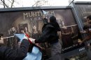 File photo shows demonstrators throwing eggs and attacking billboards advertising the TV series "The Magnificent Century" during a protest near the Show TV headquarters in Istanbul