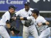 New York Yankees' Suzuki, Granderson and Swisher celebrate after they beat Seattle Mariners in MLB game in New York