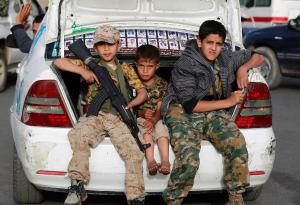 Yemeni children sit in a car boot during a march of&nbsp;&hellip;