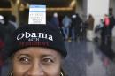 Sheryl Harvey is shown with her ticket to President Obama's final scheduled speech. (Chris Sweda/Chicago Tribune via AP)