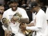 The Miami Heat's Dwyane Wade, right, holds the Larry O'Brien NBA Championship Trophy as LeBron James holds his Bill Russell NBA Finals Most Valuable Player Award after Game 7 of the NBA basketball championship game against the San Antonio Spurs, Friday, June 21, 2013, in Miami. The Miami Heat defeated the San Antonio Spurs 95-88 to win their second straight NBA championship. (AP Photo/Lynne Sladky)