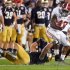 Alabama's Eddie Lacy tries to get past Notre Dame's Manti Te'o during the first half of the BCS National Championship college football game Monday, Jan. 7, 2013, in Miami. (AP Photo/John Bazemore)