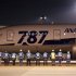 Airport staff send off All Nippon Airways' Boeing Co's 787 Dreamliner plane before it's take off for Tokyo-San Jose flight service at New Tokyo international airport in Narita, Japan