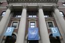 FILE - In this May 28, 2015 file photo, banners hang from a building at Barnard College in New York. Barnard College has decided to admit transgender women, becoming the latest women's college to issue a new policy acknowledging the fluidity and complexity of gender. (AP Photo/Seth Wenig, File)