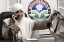 In this Wednesday, Oct. 9, 2012 photo, Azza el-Gharf of the Muslim Brotherhood's Freedom and Justice Party talks on her mobile phone at the party's office in Cairo, Egypt. El-Garf, a 47-year-old mother of seven who joined the Brotherhood when she was 15, said that a woman's role in her family need not contradict with her participation in politics, saying that she balances these two responsibilities. The rise of the Muslim Brotherhood to power in Egypt has brought with it a new group of female politicians who say they are determined to bring more women into leadership roles _ and at the same time want to consecrate a deeply conservative Islamic vision for women in Egypt.(AP Photo/Maya Alleruzzo)