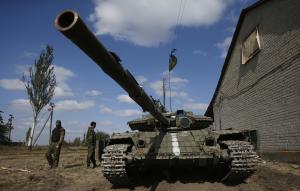 Ukrainian soldiers stand next to a tank near Donet &hellip;