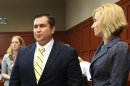 George Zimmerman, left, smiles while standing next to defense counsel Lorna Truettwhile, waiting for the jury to leave the courtroom during the 15th day of his trial in Seminole circuit court, in Sanford, Fla., Friday, June 28, 2013. Zimmerman is charged with second-degree murder for the 2012 shooting death of Trayvon Martin. (AP Photo/Orlando Sentinel, Joe Burbank, Pool)