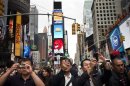 People take photos in Times Square in New York