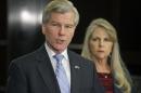 Former Virginia Gov. Bob McDonnell makes a statement as his wife, Maureen, listens during a news conference in Richmond, Va., Tuesday, Jan. 21, 2014. McDonnell and his wife were indicted Tuesday on corruption charges after a monthslong federal investigation into gifts the Republican received from a political donor. (AP Photo/Steve Helber)