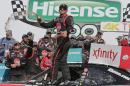 Austin Dillon celebrates in Victory Lane after winning the NASCAR Xfinity series auto race at Charlotte Motor Speedway in Concord, N.C., Saturday, May 23, 2015. (AP Photo/Chuck Burton)