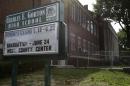 This Thursday, July 5, 2012 photo shows the exterior of the 88 year-old Charles E. Gorton High School in Yonkers, N.Y. The Yonkers school district is looking for investors to pay for a $1.7 billion overhaul of dozens of schools, including Gorton, built in 1924 and 43% over-enrolled, according to school district officials. To replace the building would cost $128 million and to overhaul it with repairs would cost $428 million, according to John Carr, who heads up the Yonkers Public Schools Facilities division. Across the country, innovative deals are now being discussed that would put essential pieces of public infrastructure in the hands of global investment firms, the latest effort to cope with a lingering fiscal crisis that has left some communities unable to pay for their needs. (AP Photo/Kathy Willens)