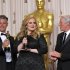 Adele and Paul Epworth pose with their award for best original song for "Skyfall" with presenter Richard Gere during the Oscars at the Dolby Theatre on Sunday Feb. 24, 2013, in Los Angeles. (Photo by John Shearer/Invision/AP)