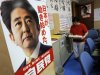 A poster of Japanese Prime Minister Shinzo Abe is displayed at the ruling Liberal Democratic Party headquarters in Tokyo, Friday, June 14, 2013. Japan's Cabinet approved a blueprint for reforms Friday meant to improve competitiveness and shore up long-term growth in the world's third-largest economy as its population ages and shrinks. Abe has outlined the reforms in whole and in part since taking office in December, calling them the "third arrow" in his economic recovery program. The poster reads: "Japan has begun to move." (AP Photo/Itsuo Inouye)