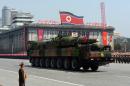 A military vehicle carries a missile during a parade in Pyongyang on April 15, 2012