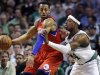 Philadelphia 76ers forward Andre Iguodala, left, posts up on Boston Celtics forward Paul Pierce (34) during the first quarter of Game 1 in the NBA basketball Eastern Conference semifinal playoff series, Saturday, May 12, 2012, in Boston. (AP Photo/Elise Amendola)