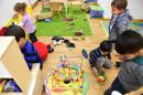 Children play at a day-care centre in the Georg Kriedte Haus home for migrants in Berlin on October 8, 2015