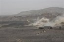 Yemeni army forces fire a missile towards positions of al Qaeda-linked militants in Abyan