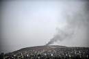 Smoke rises from the Syrian town of Ain al-Arab, known as Kobane by the Kurds, on October 3, 2014