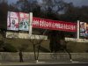 A North Korean soldier stands beneath roadside propaganda which reads "Let's Uphold the Military First Revolutionary Leadership of the Great Comrade Kim Jong Un With Loyalty" in Pyongyang on Tuesday, April 9, 2013. (AP Photo/David Guttenfelder)