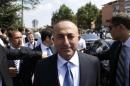 Turkish Foreign Minister Mevlut Cavusoglu leaves Kocatepe Mosque after Friday prayers in Ankara