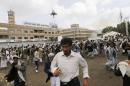 People flee after a suicide attack in Sanaa
