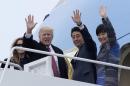 President Donald Trump and Japanese Prime Minister Shinzo Abe, accompanied by their wives, first lady Melania Trump and Akie Abe, wave before boarding Air Force One at Andrews Air Force Base Md., Friday, Feb. 10, 2017. Trump is hosting Abe at his estate Mar-a-Lago in Palm Beach, Fla., for the weekend. (AP Photo/Susan Walsh)