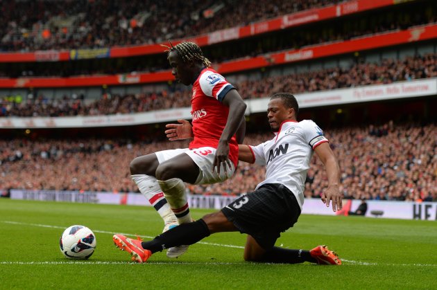 LONDON, ENGLAND - APRIL 28:  Patrice Evra of Manchester United tackles Bacary Sagna of Arsenal during the Barclays Premier League match between Arsenal and Manchester United at Emirates Stadium on April 28, 2013 in London, England.  (Photo by Shaun Botterill/Getty Images)