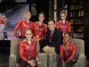 This Tueday, July 31, 2012 photo released by NBC shows the US Women's Gymnastics team, winners of the gold medal for women's team gymnastics, Kyla Ross, standing left, Jordyn Wieber, seated left, Aly Raisman, standing center, McKayla Maroney, and Gabby Douglas, seated right, with NBC Sports' Bob Costas in London. NBC is set to "break even" on its Olympics coverage, rather than lose money as previously expected, the head of NBCUniversal said Wednesday, Aug. 1. The company had expected at one point to take a $200 million loss on the London Olympics. NBC paid $1.2 billion for the rights to show the games on TV and online in the U.S. It has said that it sold more than $1 billion in ads, breaking the record of $850 million set during the Beijing Olympics in 2008. (AP Photo/NBC, Paul Drinkwater)