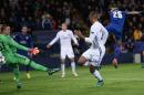 Leicester City's Riyad Mahrez (R) shoots past FC Copenhagen's goalkeeper Robin Olsen (L) to scores his team's first goal during at the King Power Stadium in Leicester, central England on October 18, 2016